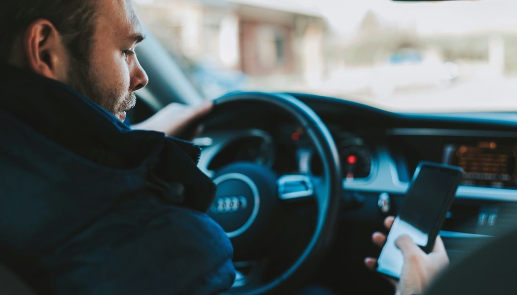 The Growing Issue of Distracted Driving and Its Legal Consequences